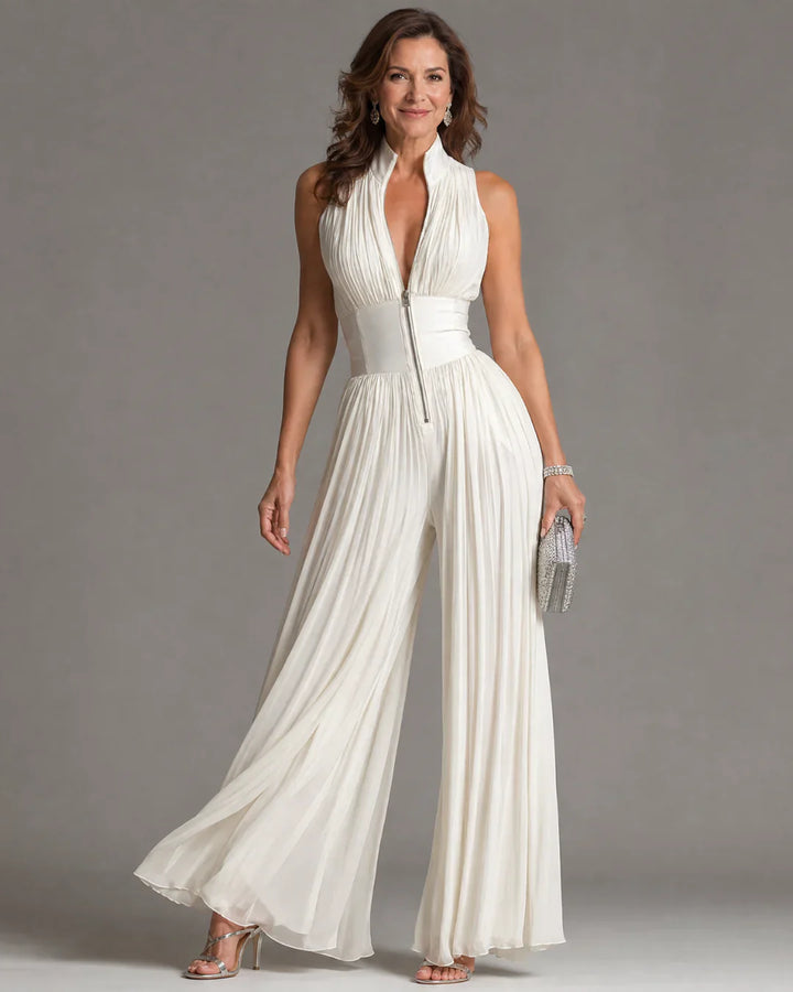 Tuta in chiffon bianca senza maniche con scollo a V, zip e pantaloni a gamba larga plissettati